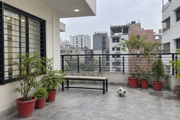 Illustrative photo: School terrace play space with a football and plants